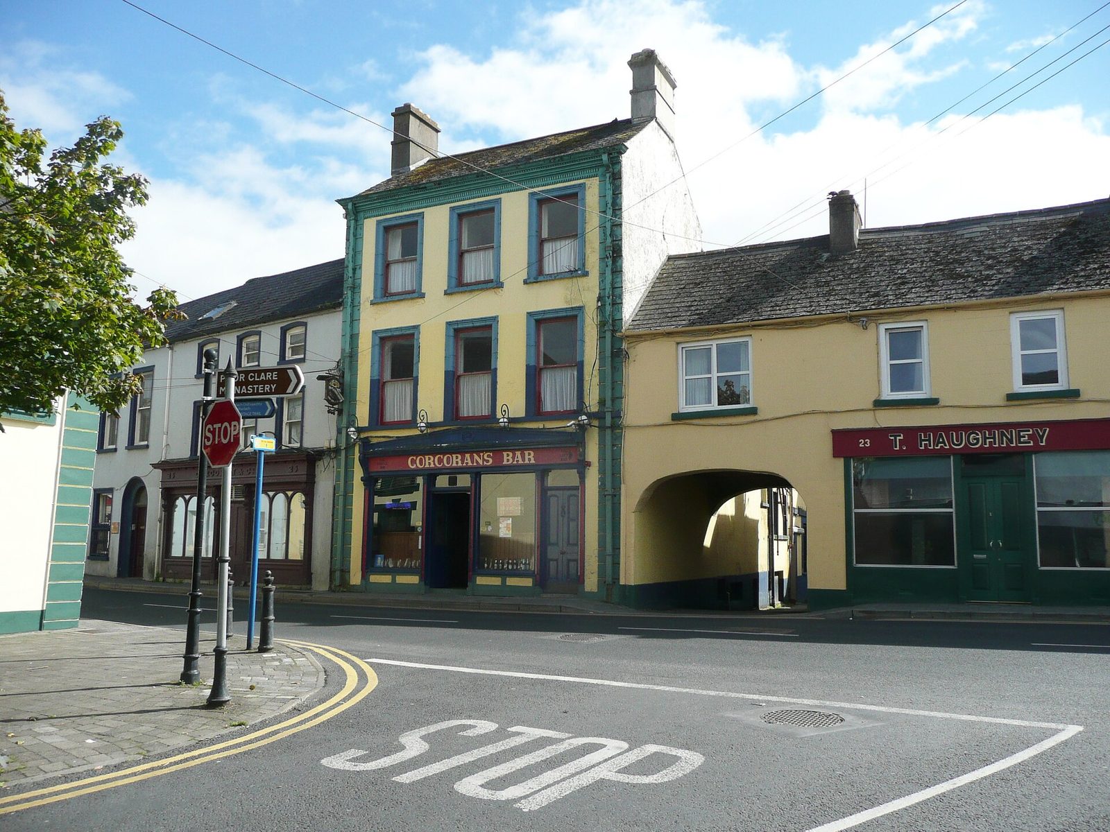 Corcoran's Bar on Bridge Street: a tall green and cream shopfront on a corner